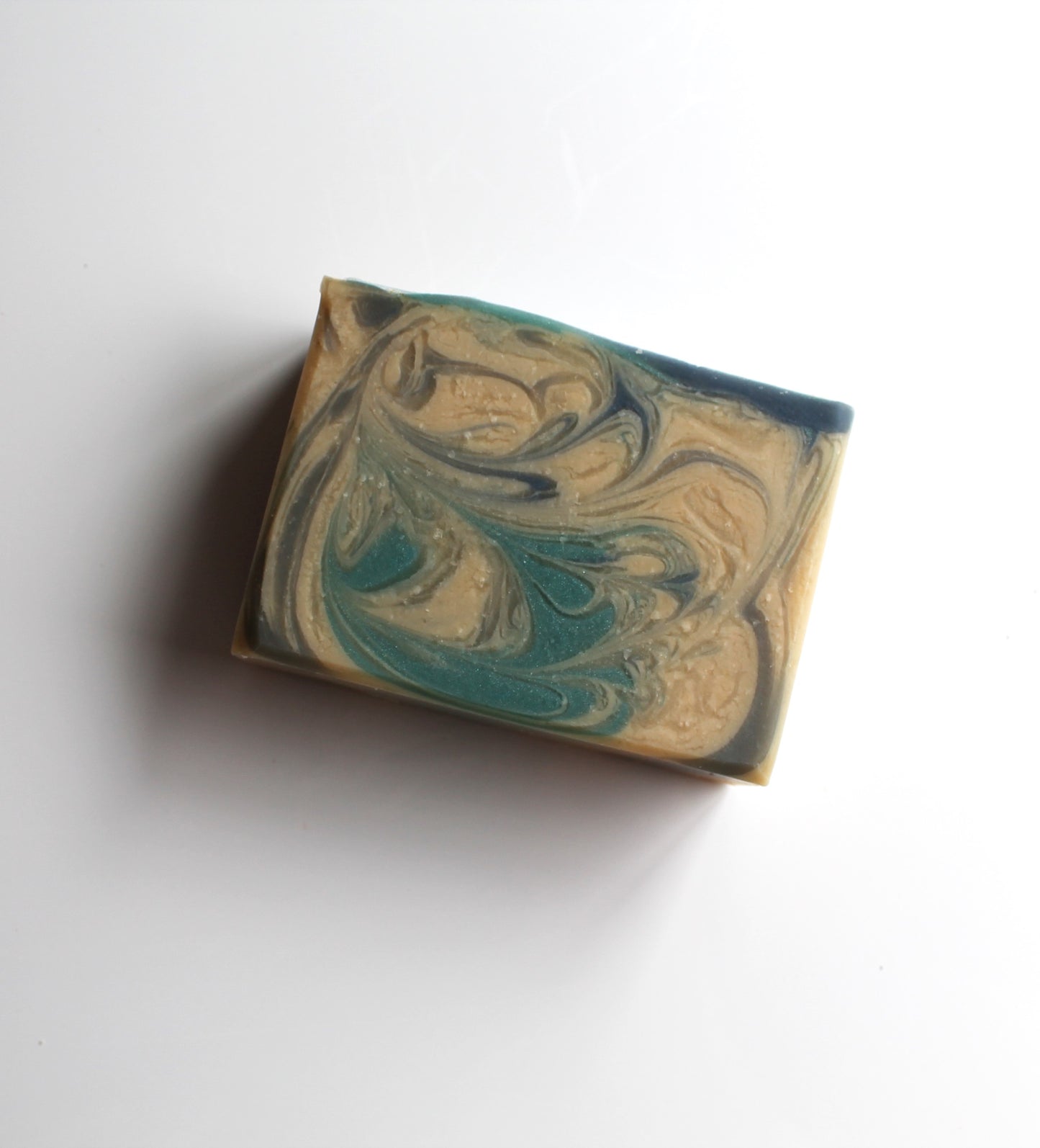 Marbled blue and white soap on a white background.