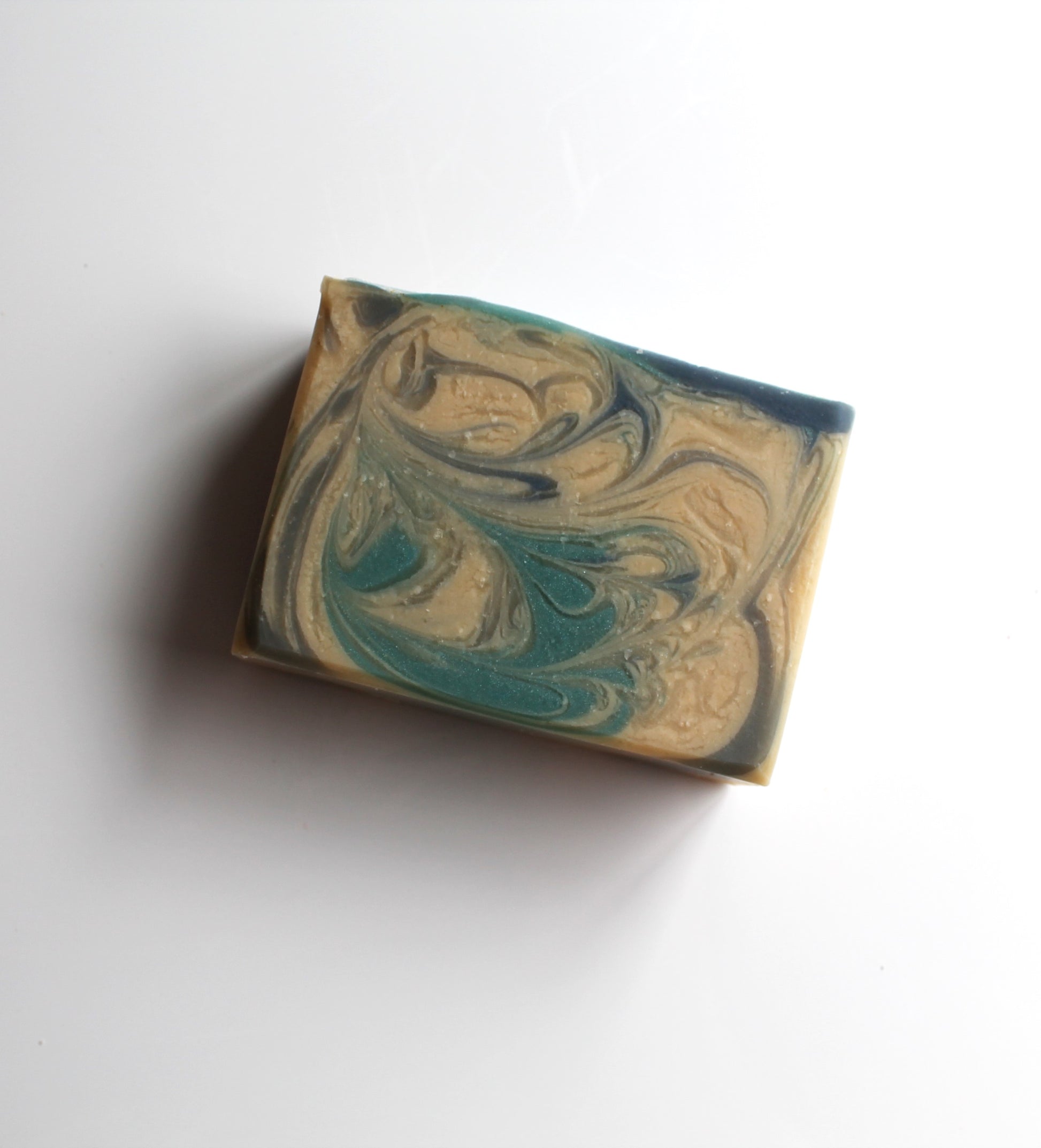 Marbled blue and white soap on a white background. 